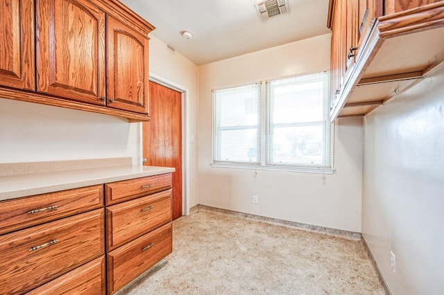 kitchen with light colored carpet