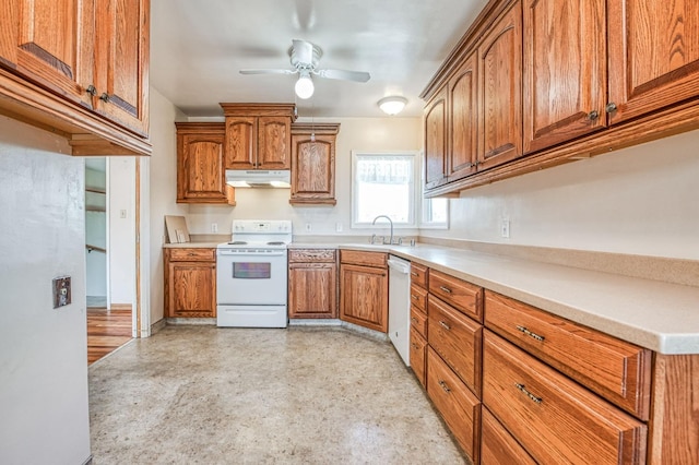 kitchen featuring sink, white appliances, and ceiling fan