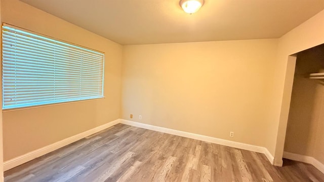 1859 S Karen Ave, Fresno, CA 93727 - unfurnished bedroom featuring wood finished floors, baseboards, and a closet