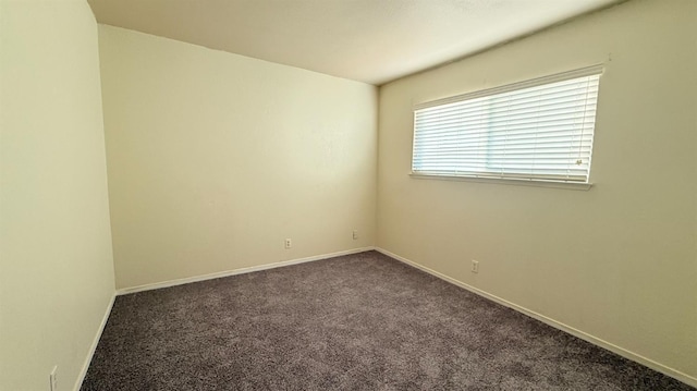 1859 S Karen Ave, Fresno, CA 93727 - empty room featuring dark colored carpet and baseboards