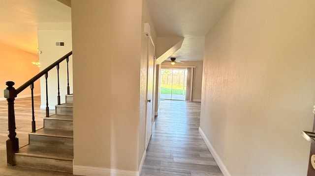 1859 S Karen Ave, Fresno, CA 93727 - stairs featuring wood finished floors, baseboards, and a ceiling fan