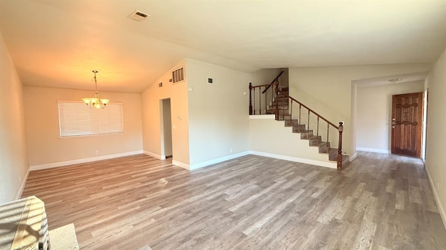 1859 S Karen Ave, Fresno, CA 93727 - unfurnished living room featuring a chandelier, stairway, light wood-style flooring, lofted ceiling, and baseboards