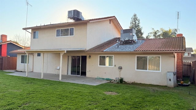 1859 S Karen Ave, Fresno, CA 93727 - back of house with central AC unit, a patio area, stucco siding, and a chimney