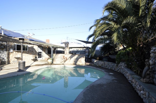 pool featuring a patio area