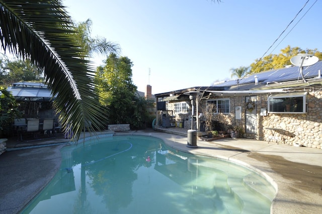 pool with a patio