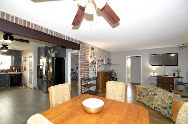 dining space with ceiling fan and wood finished floors