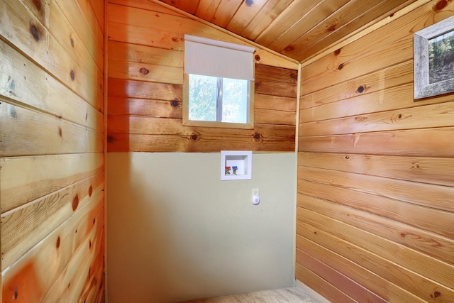 laundry room featuring wood ceiling, washer hookup, and wooden walls