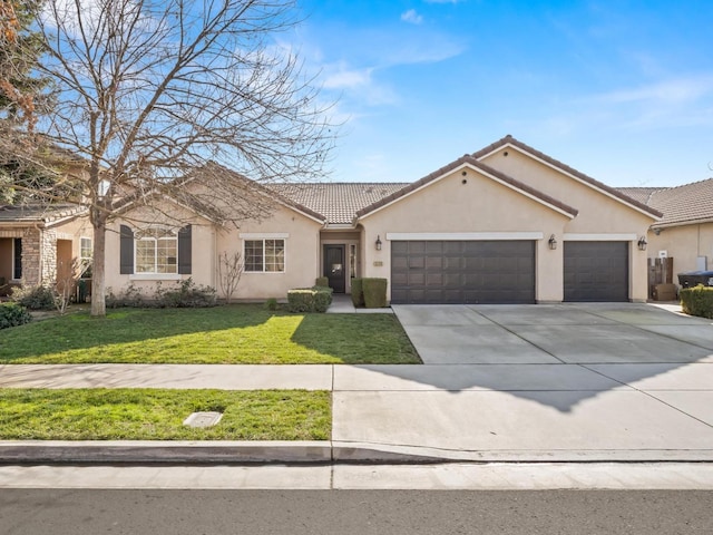 ranch-style house featuring a garage and a front yard