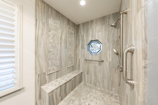 bathroom featuring tiled shower