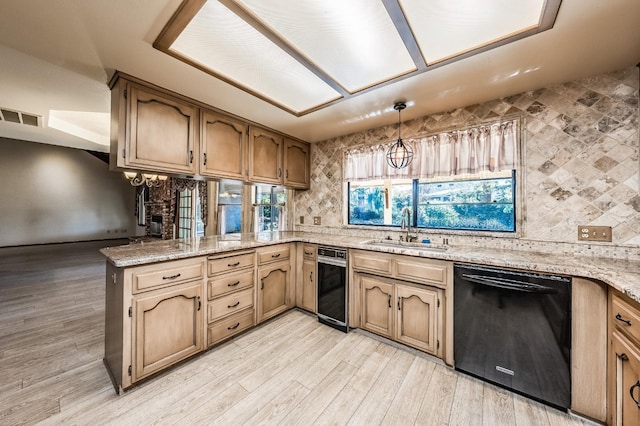 kitchen featuring sink, hanging light fixtures, black dishwasher, tasteful backsplash, and kitchen peninsula