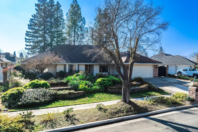 ranch-style house featuring a garage