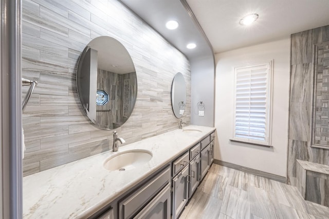 bathroom with vanity and backsplash