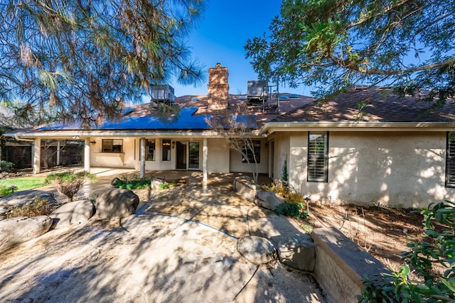 rear view of property with a patio