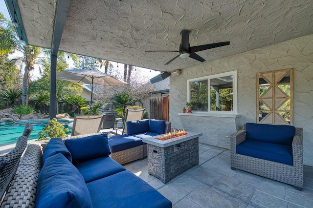 view of patio / terrace featuring an outdoor living space with a fire pit and ceiling fan