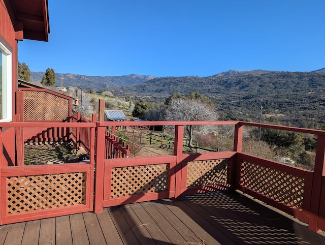 wooden deck featuring a mountain view