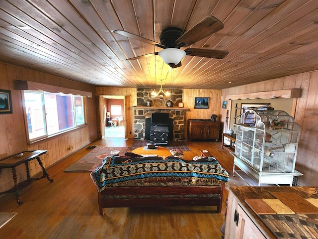 living room featuring wood ceiling, wooden walls, and hardwood / wood-style flooring