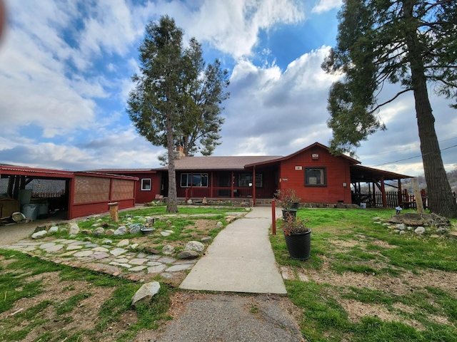 view of front of property with a carport