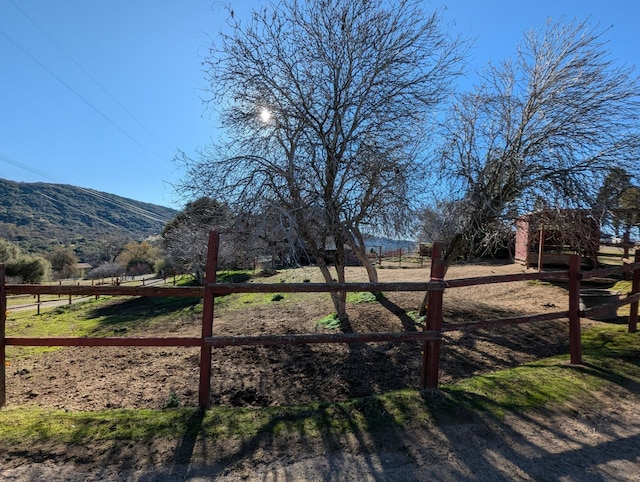 view of gate featuring a mountain view and a rural view