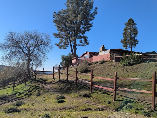 view of yard with a rural view