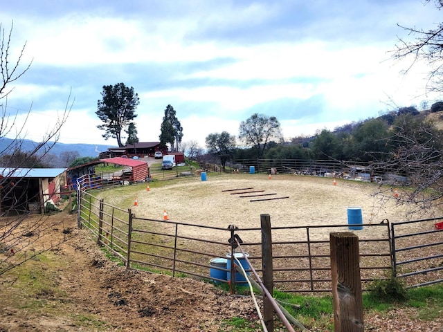 view of yard with a rural view