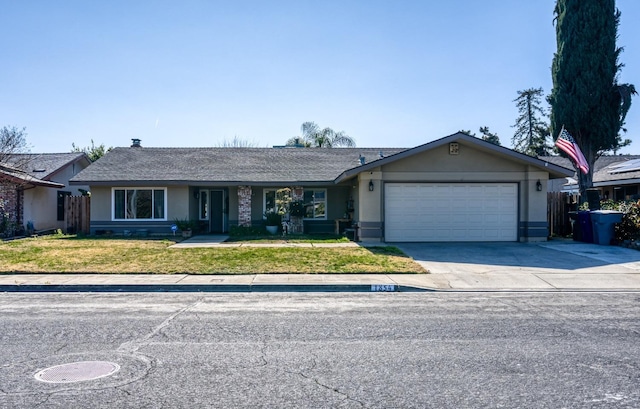 ranch-style home featuring a garage and a front yard