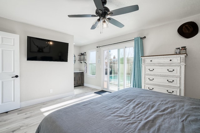 bedroom with access to exterior, ensuite bath, light hardwood / wood-style flooring, and ceiling fan