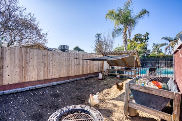 view of yard featuring a fenced in pool