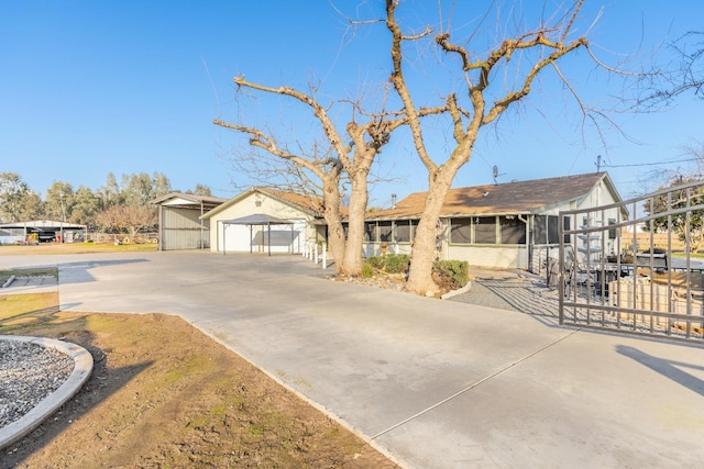 ranch-style house featuring an outbuilding and a garage