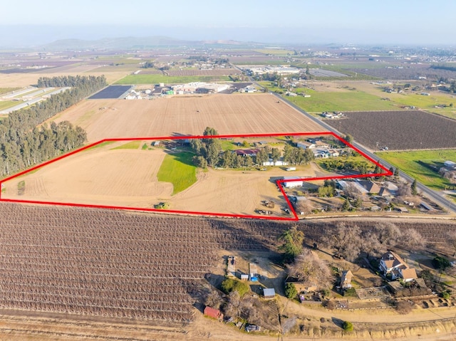 birds eye view of property with a rural view