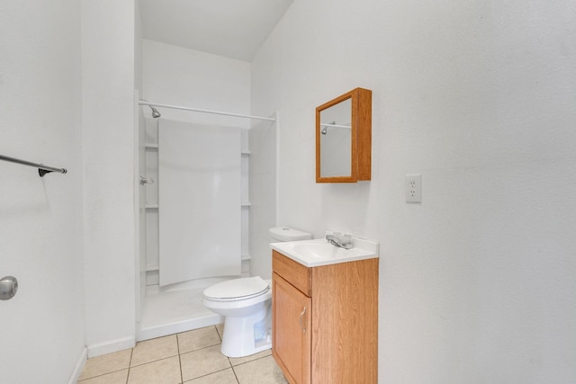 bathroom featuring vanity, toilet, tile patterned flooring, and a shower