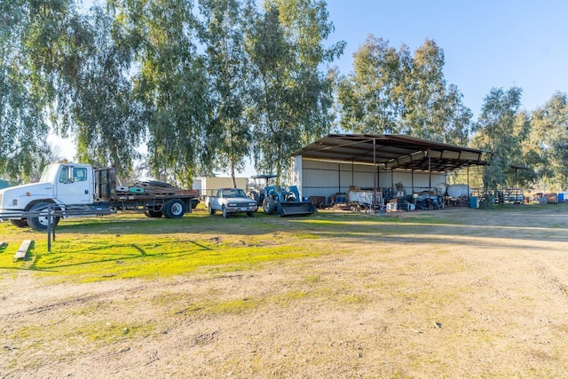 view of vehicle parking featuring a yard