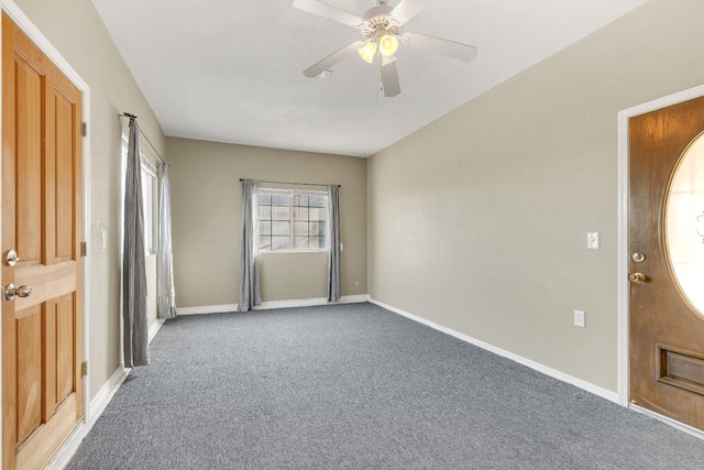 carpeted entrance foyer with ceiling fan