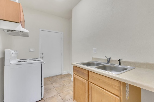 kitchen with light tile patterned flooring, sink, light brown cabinetry, and white range with electric stovetop