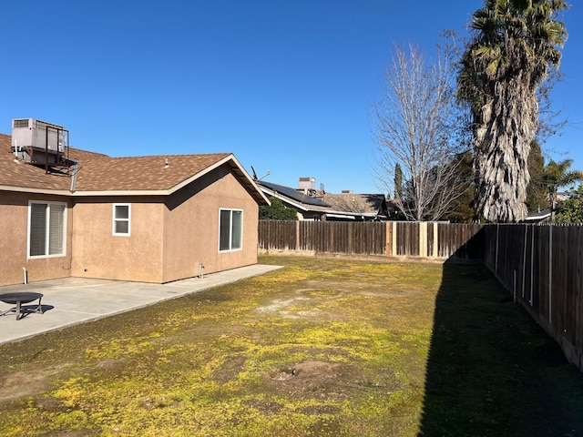 view of yard with a fenced backyard and a patio