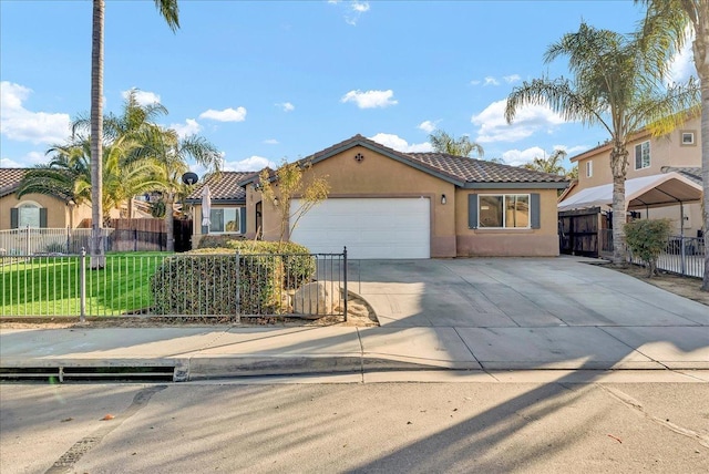 mediterranean / spanish-style home with a garage