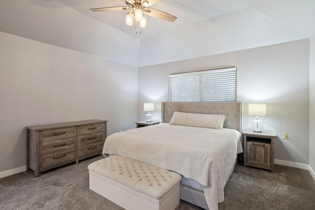 bedroom with a tray ceiling, vaulted ceiling, light colored carpet, and ceiling fan