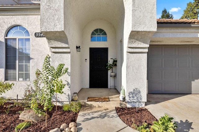 doorway to property featuring a garage