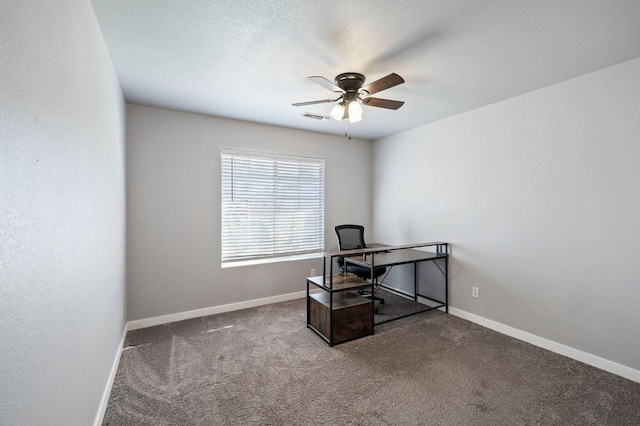 office space featuring ceiling fan and carpet