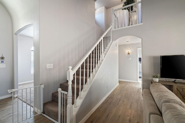 stairs featuring wood-type flooring