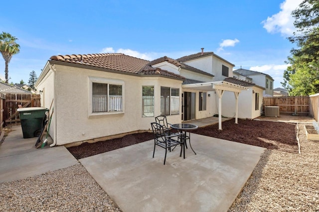 back of property featuring a pergola, central AC, and a patio area