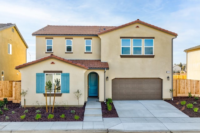 mediterranean / spanish-style home featuring a garage