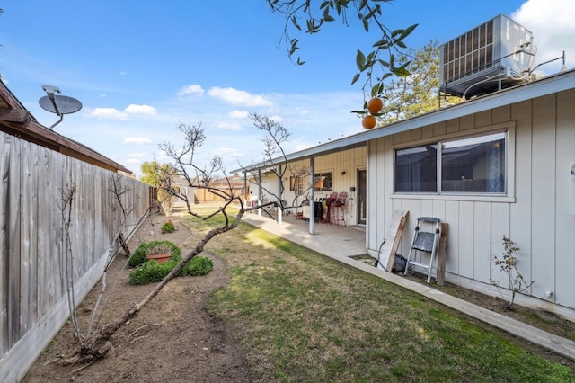 view of yard featuring cooling unit and a patio area