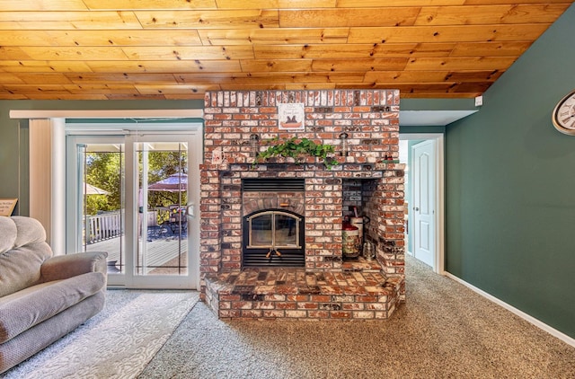 living area with lofted ceiling, carpet floors, wood ceiling, baseboards, and a brick fireplace