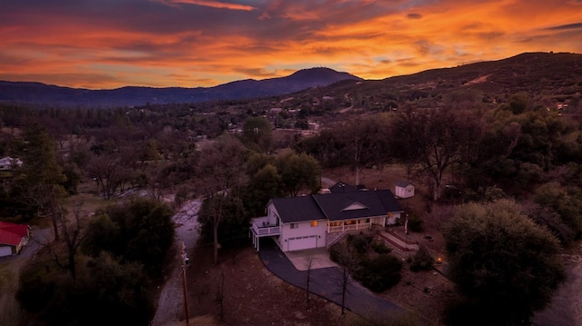 aerial view at dusk with a mountain view