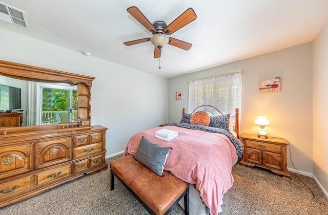 carpeted bedroom with visible vents, ceiling fan, and baseboards