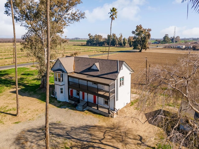 view of front of home with a rural view