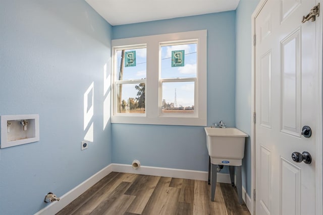 laundry area featuring washer hookup, dark hardwood / wood-style flooring, and electric dryer hookup