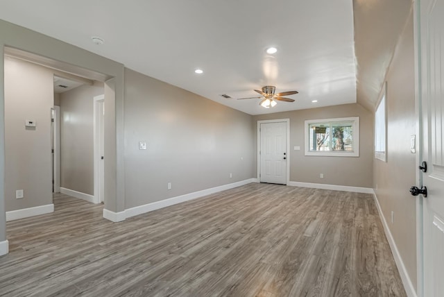 empty room featuring ceiling fan and light wood-type flooring