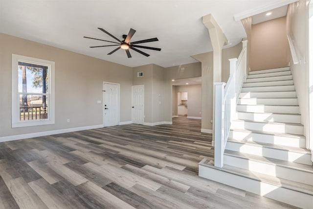 interior space with hardwood / wood-style floors and ceiling fan