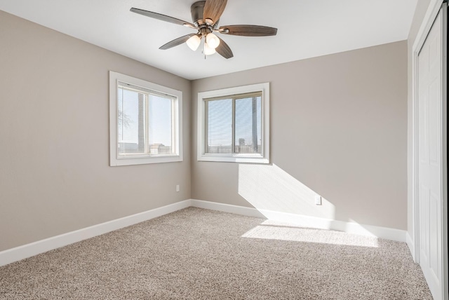 carpeted empty room with ceiling fan